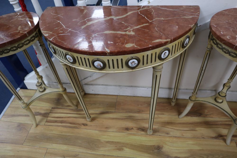 A pair of parcel gilt cream painted occasional tables with rouge marble tops and a similar demi-lune table with cracked marble top